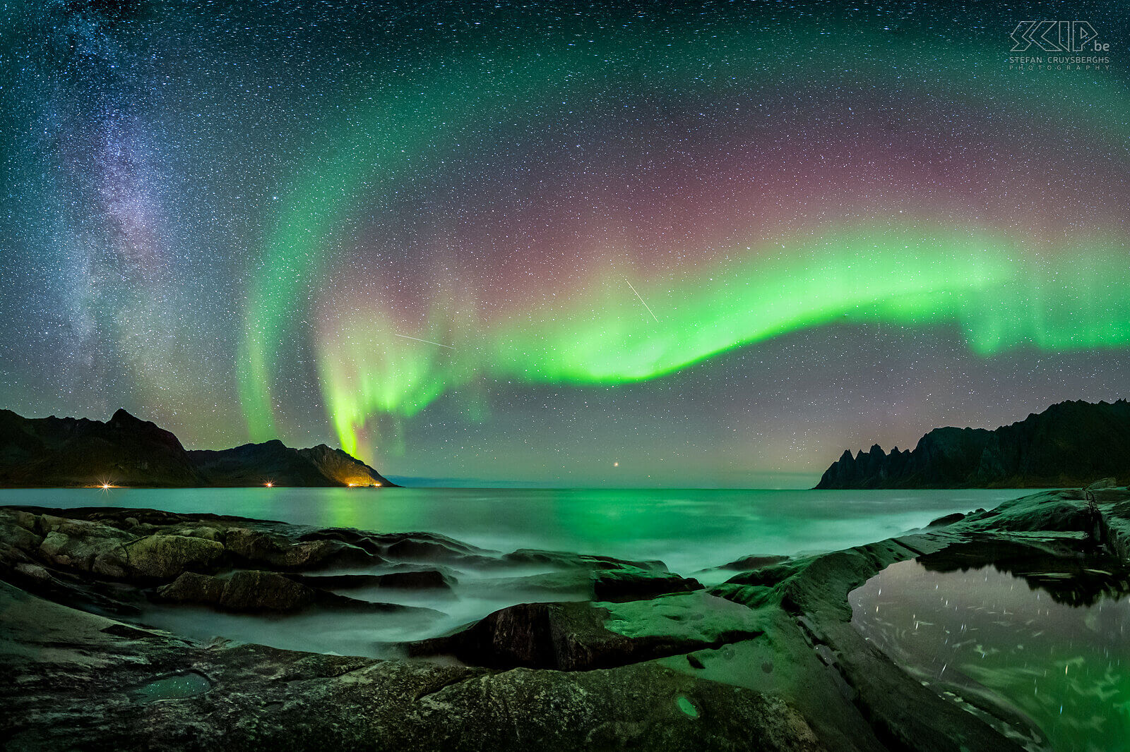 Norway - Senja - Tungeneset - Northern lights A panorama image of a magical night at the rocky beach of Tungeneset on Senja island in Norway. The northern lights (aurora borealis) were very active with wonderful green and red colors, the milky way was also visible and my camera captured some shooting stars. The bright star at the horizon in the middle of the image is Arcturus. Stefan Cruysberghs